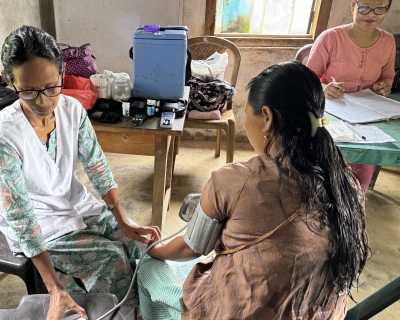 Taking blood pressure in West Garo Hills, Meghalaya state, India