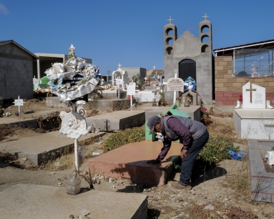 Aron Villanueva tends to the Ejido Padre Kino, Mexico, grave of his grandson Axel Villanueva. June 6, 2023. 