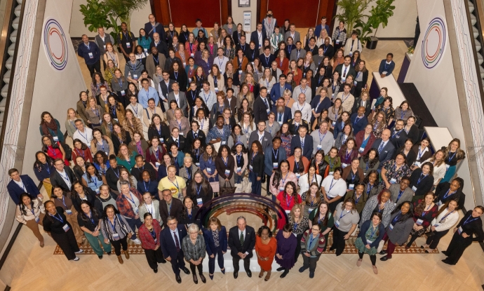 Group photo from above of Bloomberg American Health Initiative fellows and leadership at 2024 summit