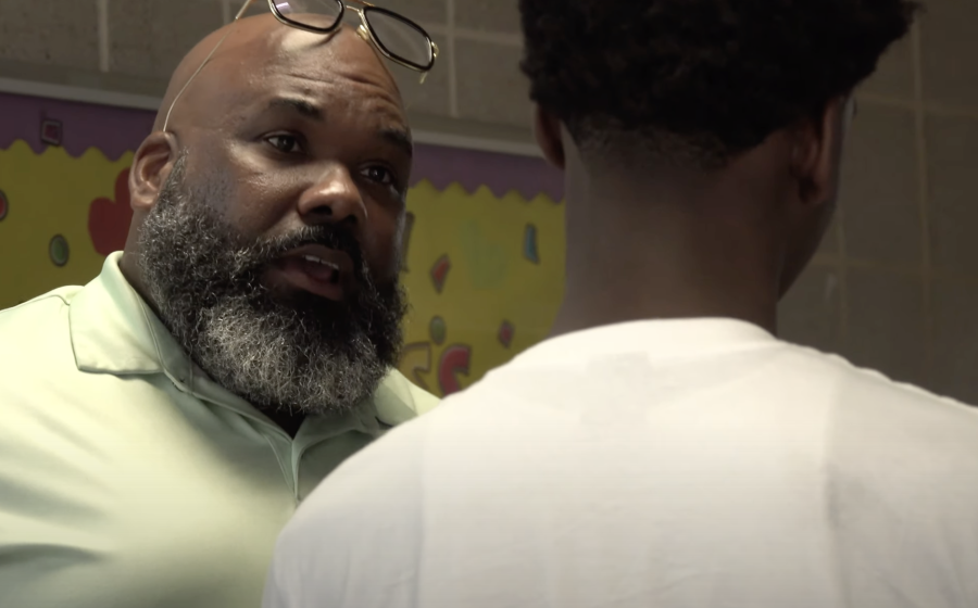 Jayson Green with Student at New Song Community Learning Center.  Jayson Green with Student at New Song Community Learning Center.